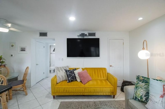 tiled living room with ceiling fan