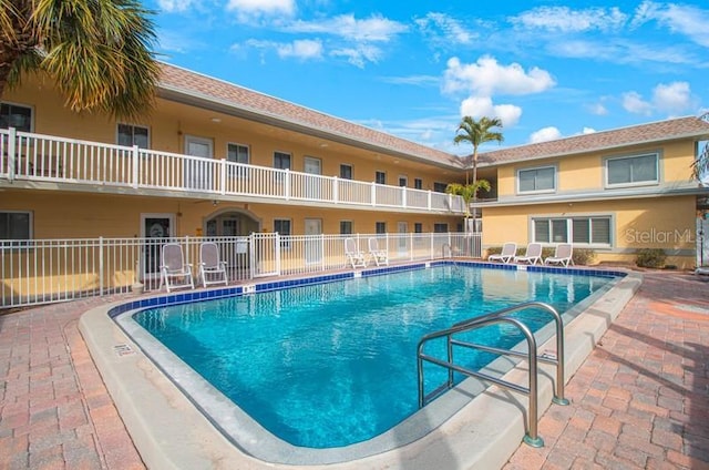 view of swimming pool with a patio