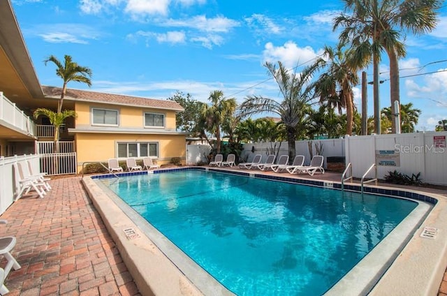 view of swimming pool with a patio area