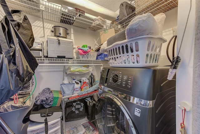 laundry room featuring washer / dryer