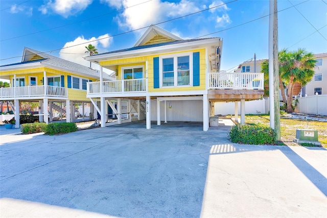 raised beach house featuring a carport