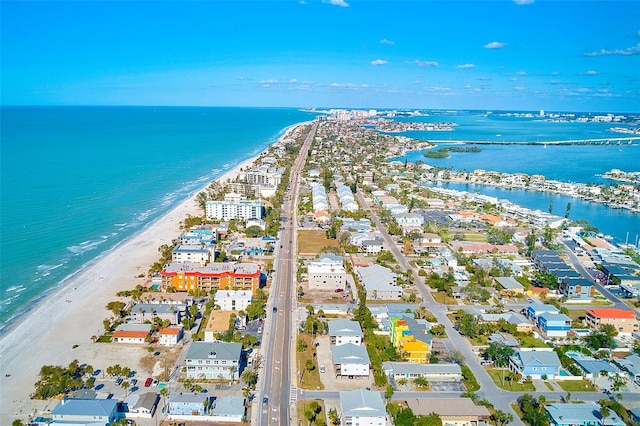 bird's eye view with a water view and a beach view