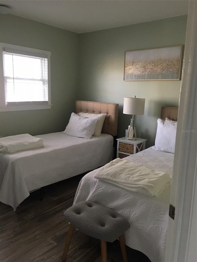 bedroom featuring dark hardwood / wood-style flooring