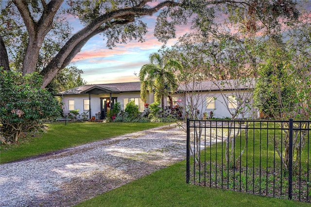 view of front of home with a yard