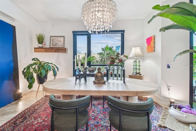 tiled dining space with a chandelier