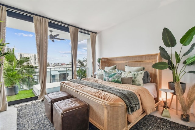 carpeted bedroom with floor to ceiling windows