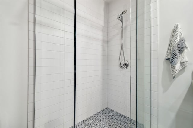 bathroom with tiled shower