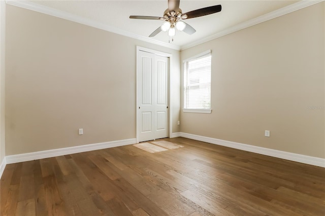 spare room with ceiling fan, hardwood / wood-style floors, and ornamental molding