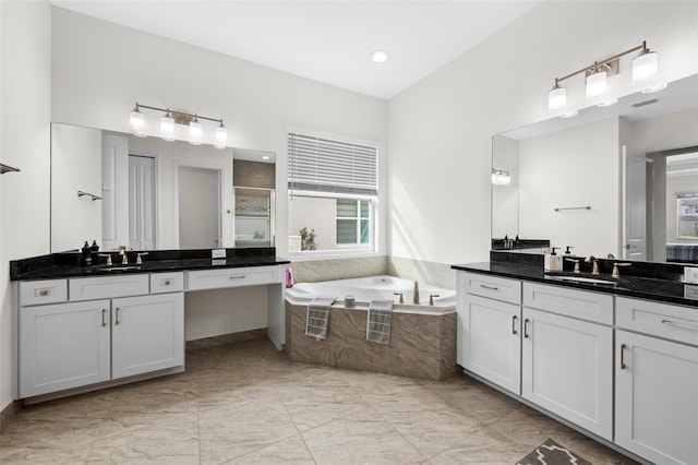 bathroom featuring vanity and shower with separate bathtub