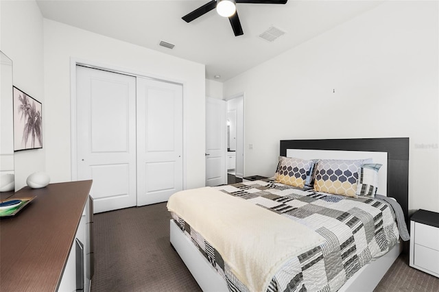 bedroom with dark carpet, a closet, and ceiling fan