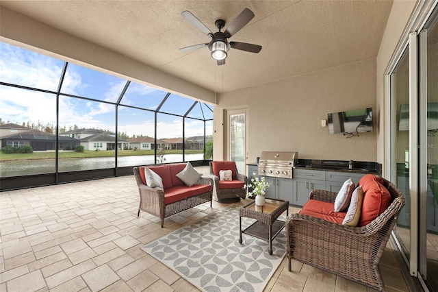 view of patio / terrace featuring outdoor lounge area, glass enclosure, a water view, ceiling fan, and a grill