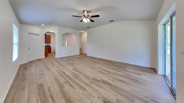 unfurnished living room with ceiling fan and light wood-type flooring