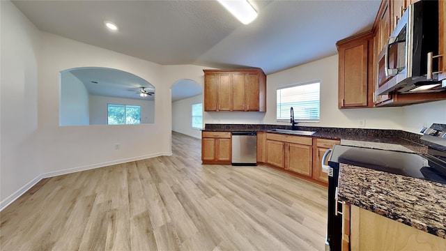 kitchen featuring appliances with stainless steel finishes, ceiling fan, a healthy amount of sunlight, and sink