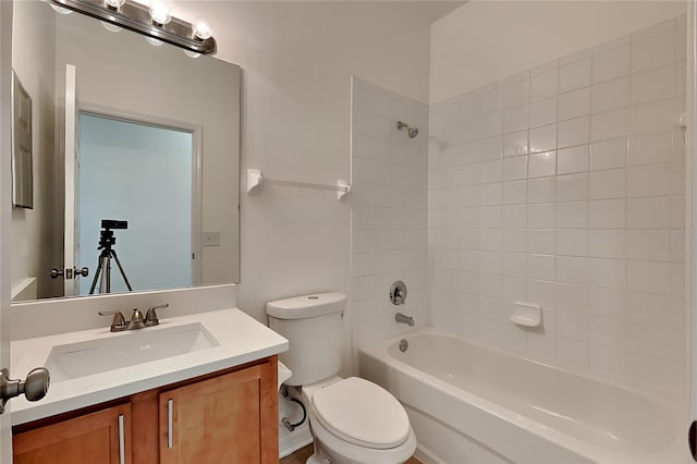 full bathroom featuring vanity, toilet, and tiled shower / bath combo