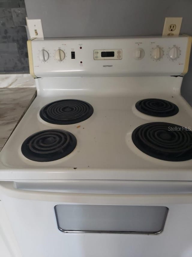 interior details featuring white electric range