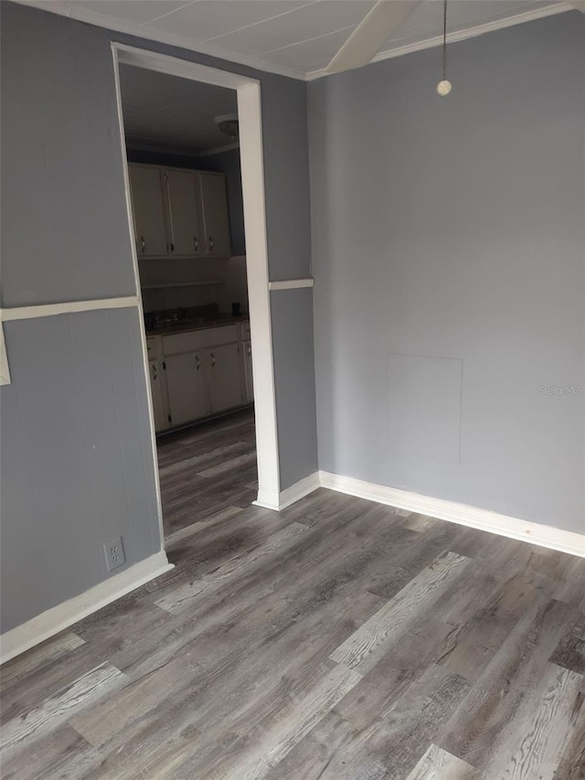 empty room with hardwood / wood-style flooring