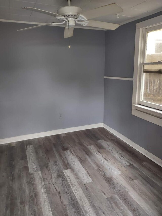 spare room with wood-type flooring and ceiling fan