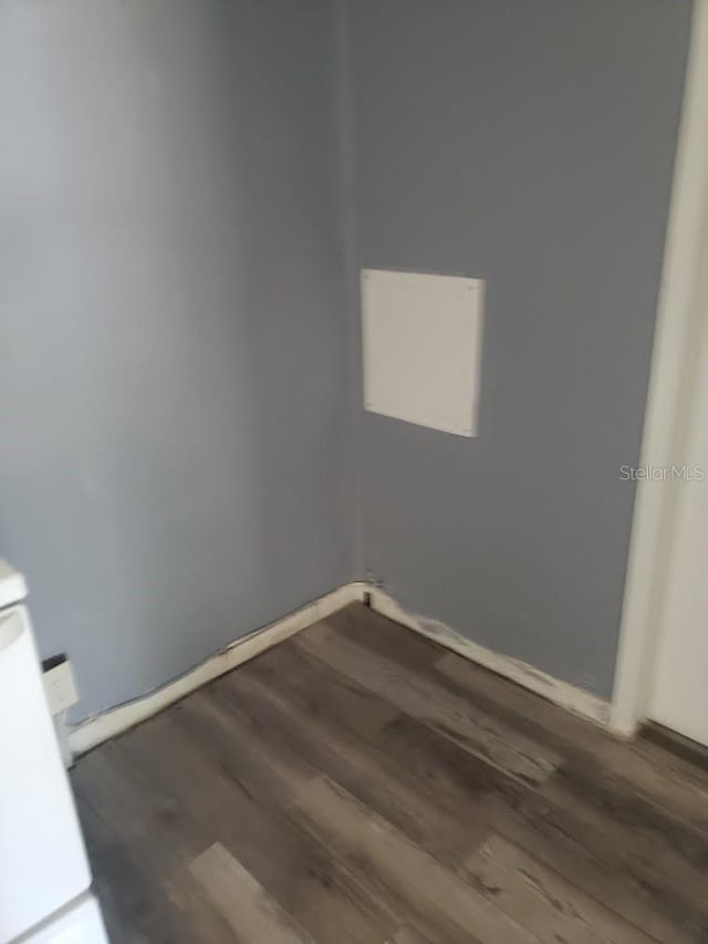 empty room featuring dark hardwood / wood-style flooring