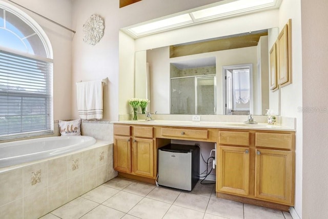 bathroom featuring tile patterned flooring, vanity, and independent shower and bath