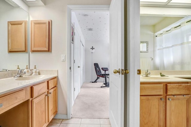 bathroom with vanity and tile patterned floors