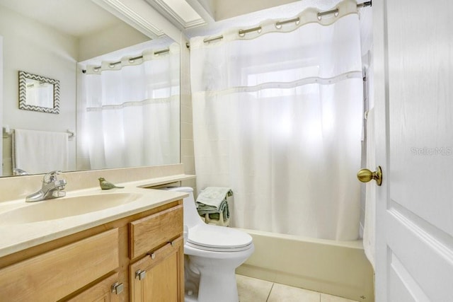 full bathroom featuring tile patterned flooring, shower / bath combo, vanity, and toilet