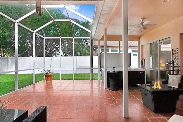 sunroom with ceiling fan and a healthy amount of sunlight