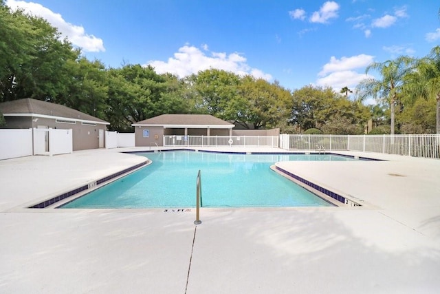 view of swimming pool featuring a patio area