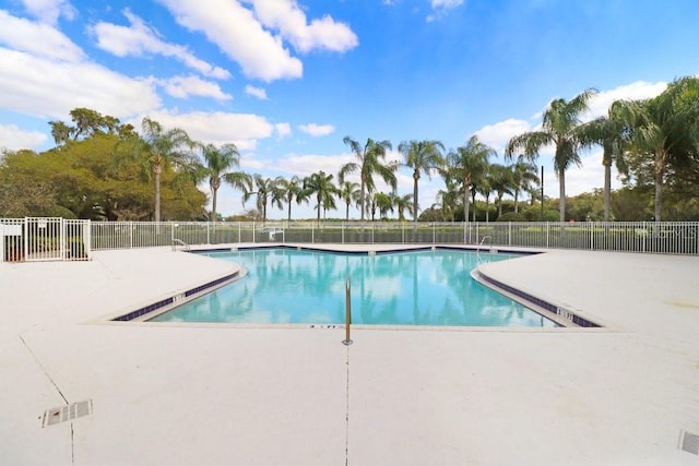 view of swimming pool with a patio