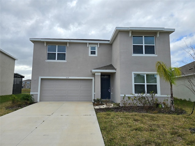 view of front of property with a garage and a front yard