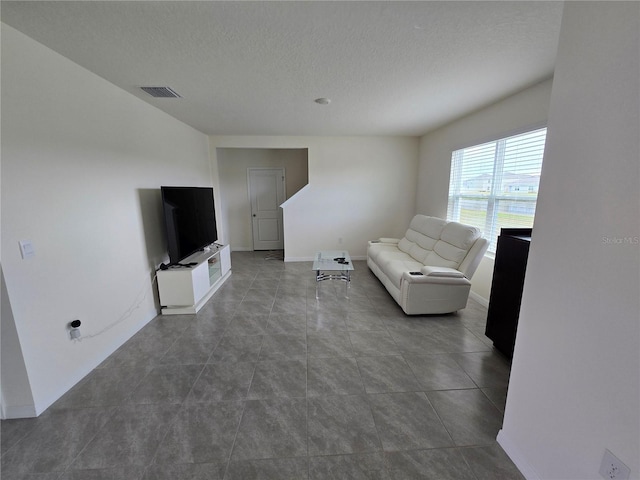 living room with a textured ceiling