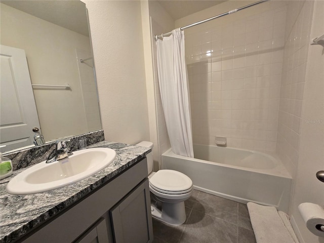 full bathroom with shower / bath combo with shower curtain, tile patterned flooring, vanity, and toilet