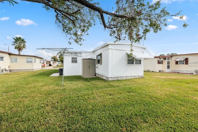 rear view of property featuring a lawn