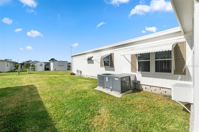 back of property with a lawn