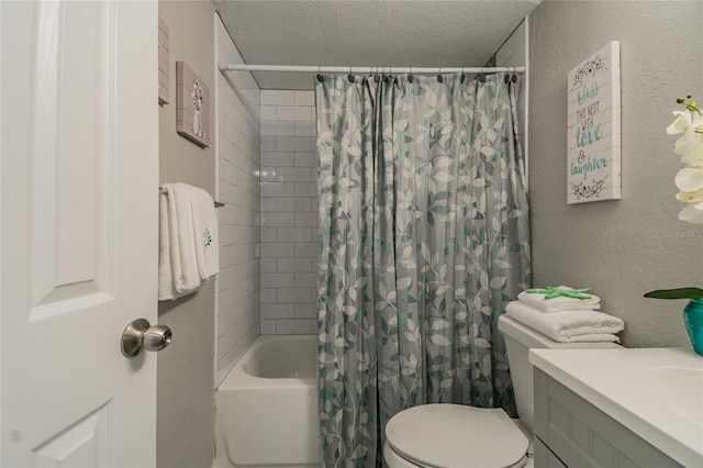 full bathroom with vanity, toilet, shower / bath combo with shower curtain, and a textured ceiling