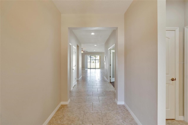 hallway with light tile patterned floors