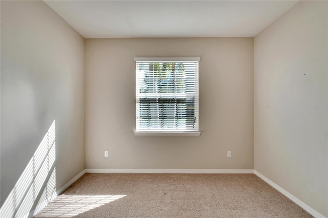 empty room with light colored carpet