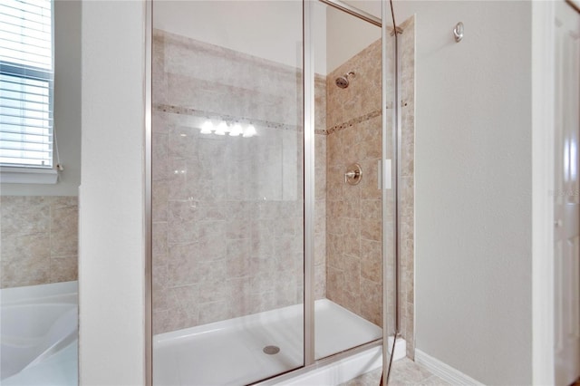 bathroom featuring an enclosed shower