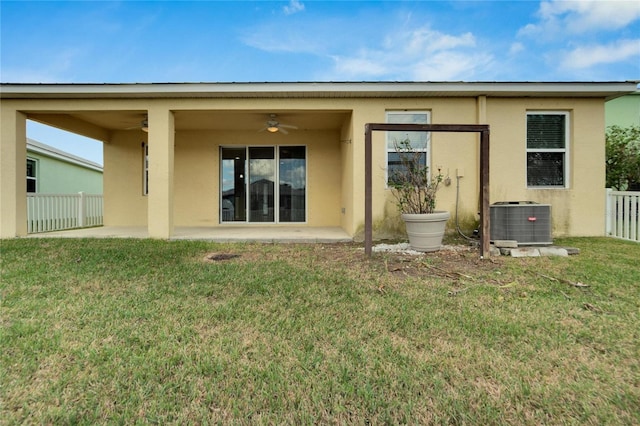 back of property featuring a patio, central AC unit, ceiling fan, and a lawn