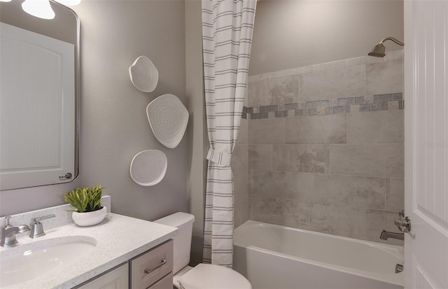 full bathroom featuring vanity, shower / bath combo, and toilet