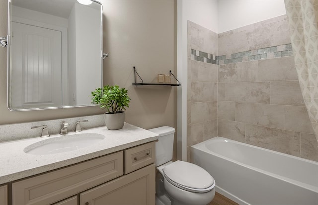 full bathroom featuring shower / bath combo, toilet, and vanity