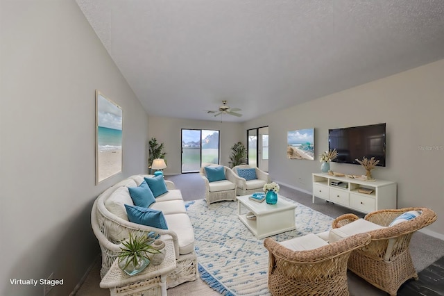 living room featuring carpet flooring, ceiling fan, and lofted ceiling