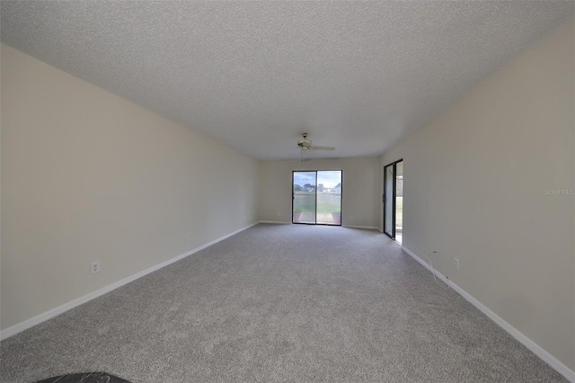 empty room with a textured ceiling, ceiling fan, and light carpet