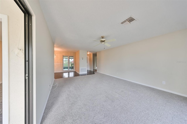 unfurnished living room featuring carpet flooring and ceiling fan