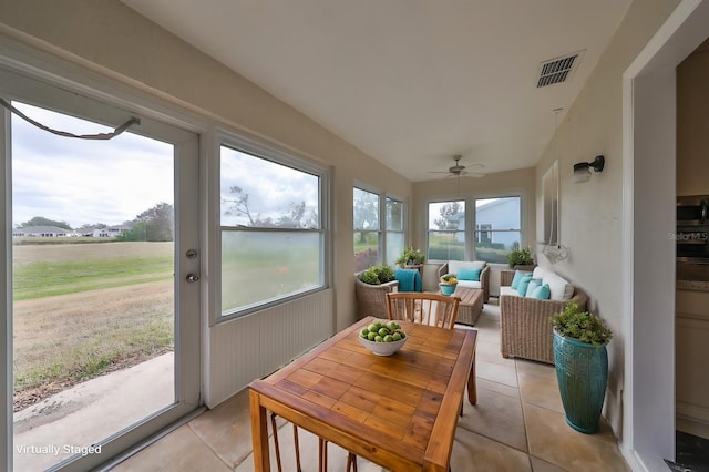 sunroom with ceiling fan and a wealth of natural light