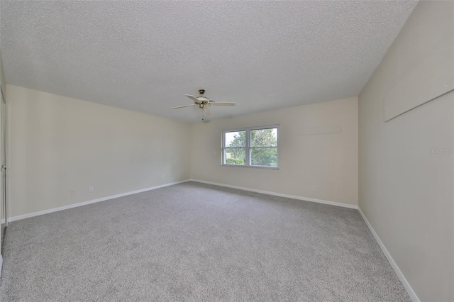 carpeted empty room with a textured ceiling and ceiling fan