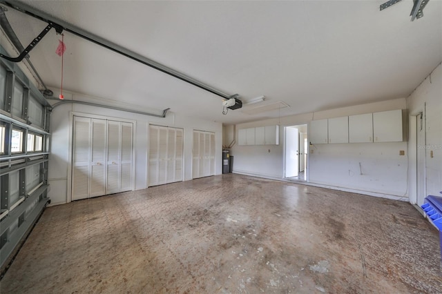 garage with a garage door opener and water heater