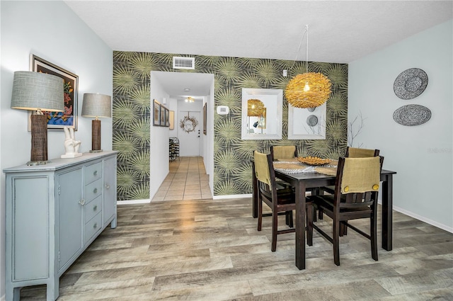 dining space with light wood-type flooring