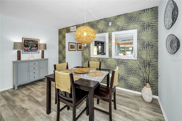 dining space featuring hardwood / wood-style flooring