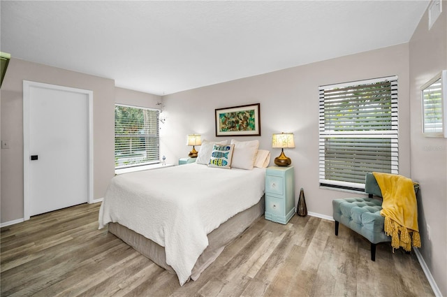 bedroom with light hardwood / wood-style flooring