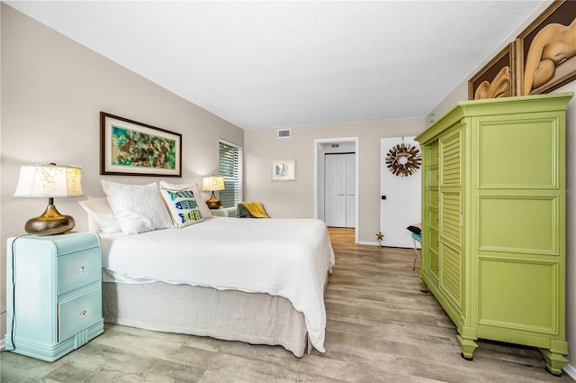 bedroom with light wood-type flooring